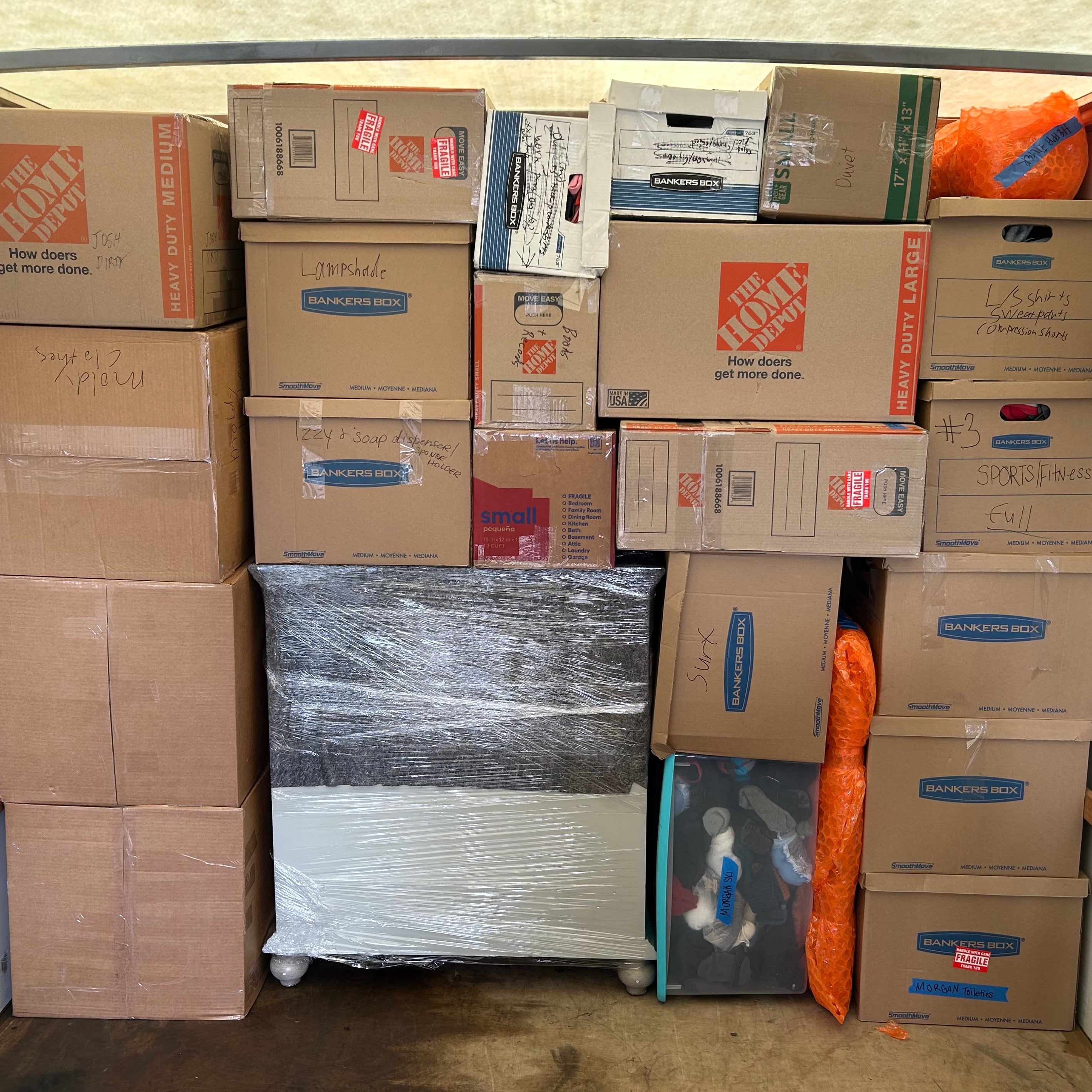 Boxes and wrapped furniture prepared for moving