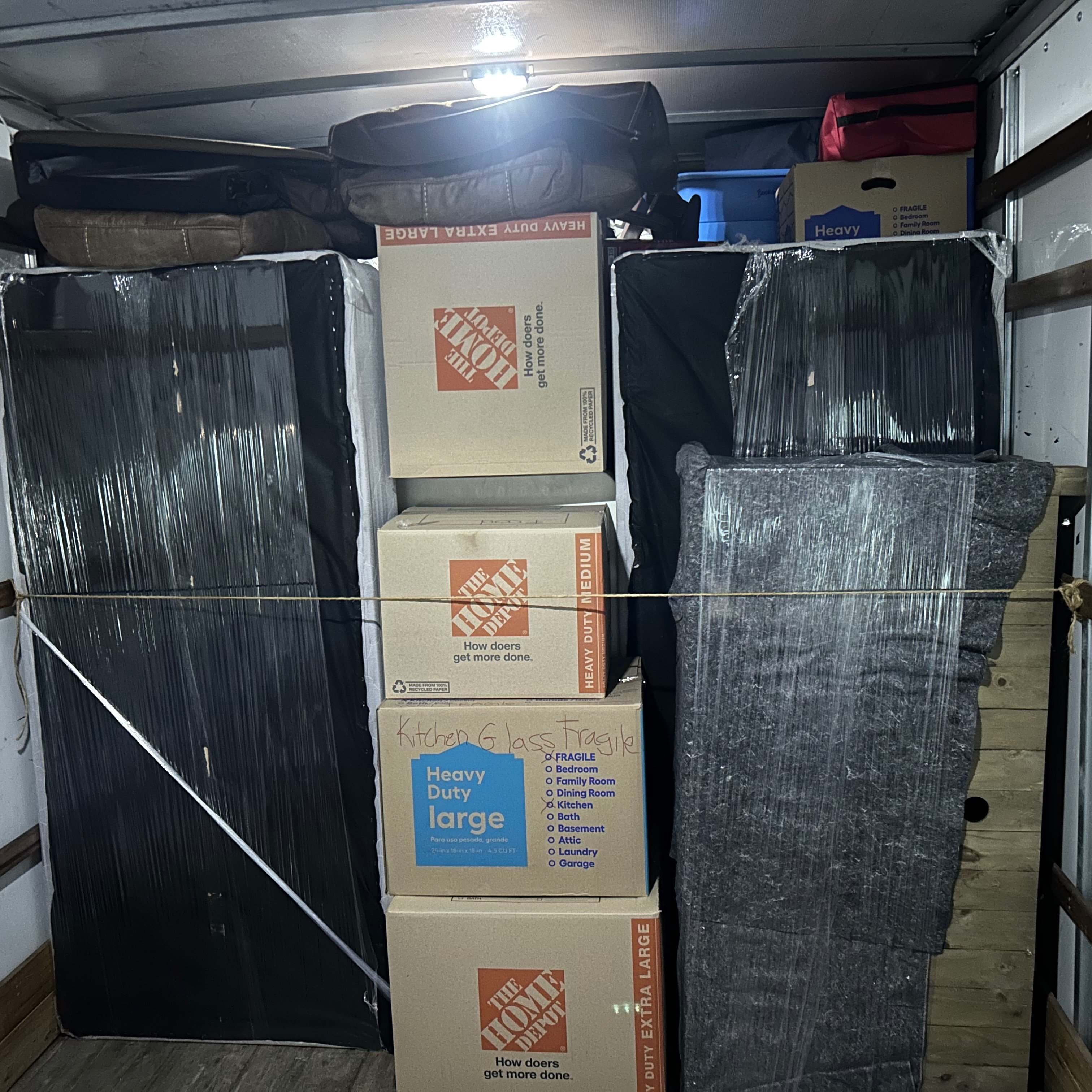 Protected furniture and boxes prepared for a move